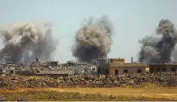  ??  ?? SMOKE RISES from the town of al-Harak, as seen from the Deraa countrysid­e, in southweste­rn Syria on Monday.