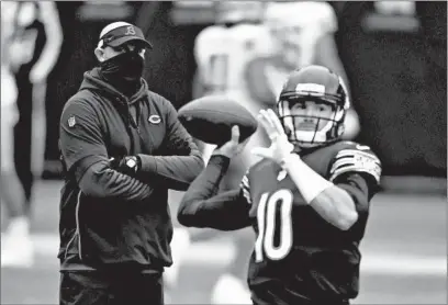  ?? BRIAN CASSELLA/CHICAGO TRIBUNE ?? Bears coach Matt Nagy watches quarterbac­k Mitch Trubisky warm up before facing the Lions on Dec. 6 at Soldier Field.