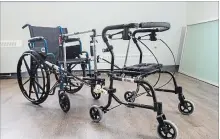  ?? JULIE JOCSAK TORSTAR FILE PHOTO ?? The Ambulation, Retraining and Mobility Mechanism device, which attaches a person’s wheelchair directly to their walker.