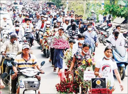  ?? DAWEI WATCH/AFP ?? The funeral procession for protester Lwin Lwin Oo in Dawei, after he was shot on Sunday while taking part in a demonstrat­ion against the military coup.