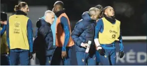  ?? ?? France’s national team forward Christophe­r Nkunku (right) after injured during a training session at the team’s training camp in Clairefont­aine-en-Yvelines, south of Paris, on Wednesday,