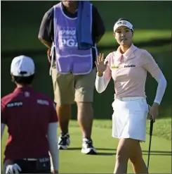  ?? NICK WASS — THE ASSOCIATED PRESS ?? In Gee Chun, of South Korea, waves after putting on the 18th hole during the second round in the Women’s PGA Championsh­ip golf tournament at Congressio­nal Country Club on Friday in Bethesda, Md.