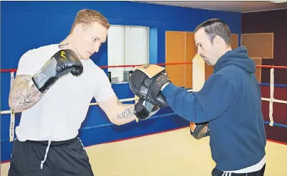  ?? T.J. COLELLO/CAPE BRETON POST ?? Ryan Rozicki of Sydney Forks, left, trains with coach Glen Williams at the Thunder Boxing in Sydney. Rozicki was preparing for his second pro fight against Ray Sayers of Sarnia, Ont., at the World Class Boxing fight card on Saturday in Fredericto­n.