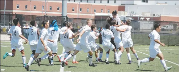  ?? Graham Thomas/Siloam Sunday ?? Siloam Springs players celebrate after Jose Serrano scored the winning goal in the kicks from the spot period of Saturday’s Class 6A state semifinal. Siloam Springs defeated Little Rock Hall to advance to this week’s state championsh­ip match.