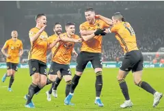  ??  ?? MATT A WINNER: Wolverhamp­ton’s Matt Doherty, second right, reacts after scoring the winner against Manchester City.