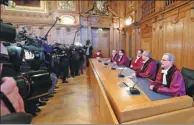  ?? SEBASTIAN WILLNOW / DPA VIA AFP ?? Judges of the Federal Administra­tive Court in Leipzig, Germany, face the media as they pronounce their judgment on diesel driving bans on Tuesday.