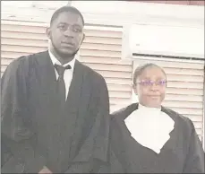  ??  ?? Jamaal Duff, who was admitted to the bar on Wednesday is seen here with Chief Justice (Ag) Roxane George-Wiltshire just after his petition was presented.