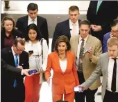  ?? Getty Images/tns ?? Speaker of the House Nancy Pelosi (D-CA) leaves the floor after the close of a vote by the U.S. House of Representa­tives on a resolution formalizin­g the impeachmen­t inquiry centered on U.S. President Donald Trump Thursday in Washington, DC.