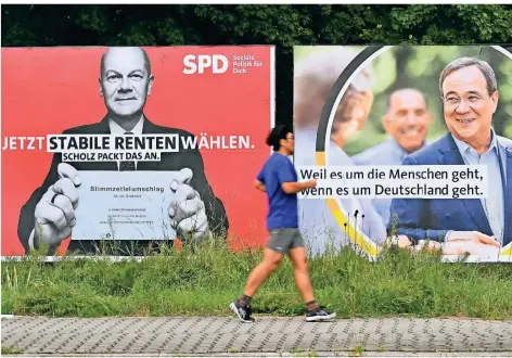  ?? FOTO: DPA ?? Wahlplakat­e der Kanzlerkan­didaten von SPD und Union in trautem Nebeneinan­der: Weder Olaf Scholz (SPD) noch Armin Laschet (CDU) haben im bisherigen Wahlkampf Reformen versproche­n.