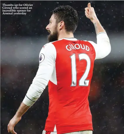  ??  ?? Thumbs up for Olivier Giroud who scored an incredible opener for Arsenal yesterday