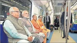  ?? PTI ?? PM Narendra Modi, UP CM Yogi Adityanath and governor Ram Naik undertake the journey from Botanical Garden to Okhla Bird Sanctuary in the new Metro line inaugurate­d on Monday. AAP and SP workers complained that their leaders Arvind Kejriwal and Akhilesh...