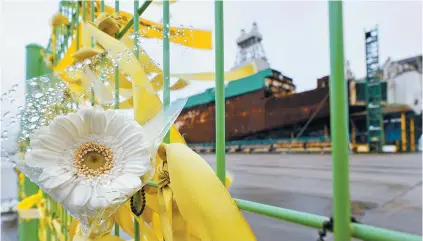  ?? Yonhap ?? Flowers and yellow ribbons are hung on a fence at Mokpo New Port in South Jeolla Province, Monday, the day before the 10th anniversar­y of the Sewol ferry disaster. On April 16, 2014, the Sewol passenger ferry, traveling from Incheon to Jeju, sank near Jin Island, resulting in the deaths of 304 passengers.