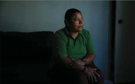  ?? AP PHOTO/JAE C. HONG ?? In this Oct. 18 photo, Iris Acosta, a 51-year-old hotel housekeepe­r from Honduras, pauses for photos in her sister’s apartment in Los Angeles. Acosta is a Temporary Protected Status recipient, a program that is geared toward countries ravaged by...