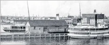  ?? SUBMITTED PHOTO ?? The Newfoundla­nd ferry wharf in North Sydney in 1906, with the Vooght Brothers department store in the right background.