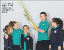  ?? PHOTO: MARC MORRIS ?? Clore Shalom pupils in the shake-up as they celebrate Succot