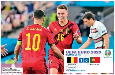  ??  ?? Belgium’s Thorgan Hazard (#16) celebrates scoring with Eden Hazard