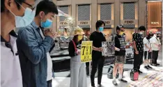  ?? | Reuters ?? PROTESTERS observed a minute’s silence after China’s parliament passed a national security law in Hong Kong, yesterday.