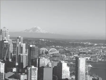  ?? PHOTO BY ALANA HUDSON ?? The mountains always greet us as we fly into Seattle, writes Alana Hudson.