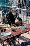  ?? CHLOE PANG/NEWYORK TIMES ?? Amasked patron eats lunch in San Francisco lastmonth. One mealmay seemto blend into another in 2020, even though it may be themost dramatic year of our lives.