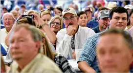  ?? HYOSUB SHIN PHOTOS / HSHIN@AJC.COM ?? Audience members listen to Vice President Mike Pence at the Sunbelt Agricultur­al Exposition in Moultrie on Tuesday. Hurricane Michael is responsibl­e for an estimated $1 billion in damages to Georgia’s agricultur­al industry.