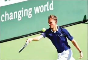  ?? AFP ?? Daniil Medvedev hits a forehand return to Gael Monfils during their Round 3 match at the Indian Wells tennis tournament in Indian Wells, California, on Monday.