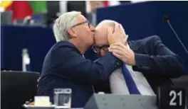  ??  ?? STRASBOURG: European Commission President Jean-Claude Juncker, left, kisses vicePresid­ent of the European Commission Frans Timmermans before delivering his State of the Union speech at the European Parliament in Strasbourg, eastern France. — AFP