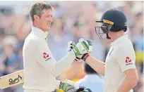  ?? Picture: Getty. ?? Keaton Jennings, left, celebrates his century with Jos Buttler.