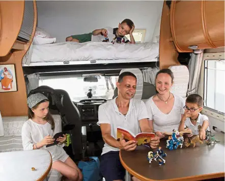  ??  ?? Happy family: Benoit, Celine and their three children spending quality time together inside the motorhome. — WAN MOHIZAN WAN HUSSEIN/ The Star