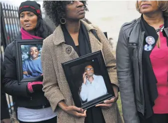  ?? JUSTIN SULLIVAN, GETTY IMAGES ?? Mothers who lost children to gun violence await the arrival of Hillary Clinton at the Kids Off the Block memorial in Chicago inMarch. The city is on pace to have 600 homicides this year.
