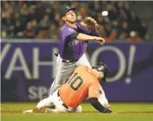  ?? Santiago Mejia / The Chronicle ?? Evan Longoria is out at second but Rockies second baseman Daniel Castro’s throw for a double play was too late at first.