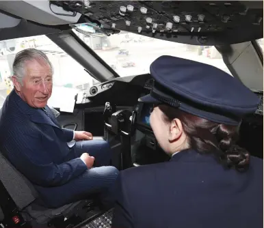  ?? (Chris Jackson/pool via Reuters) ?? PRINCE CHARLES is shown the cockpit of a British Airways 787 aircraft by BA Senior First Officer Kate Beesley during a visit to Heathrow Airport in London yesterday.