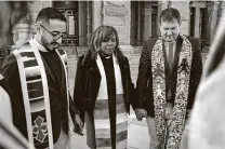  ?? Bob Owen / Staff file photo ?? In 2019, the Rev. Dr. Michael Diaz of Dallas, from left, and the Rev. Naomi L. Brown and the Rev. Andries Coetzee of San Antonio join in protest of religious discrimina­tion against gays.