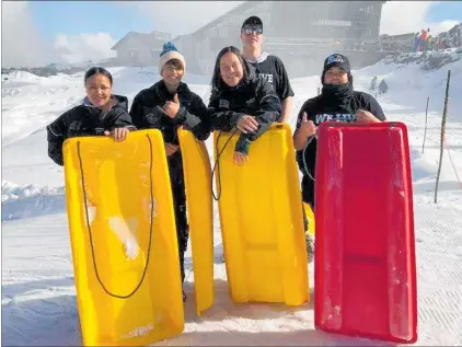  ??  ?? The Tu¯roa RAL cadet team enjoy some sledding. From left: Marie Wairepo, Taylor Harris, Stacy-Leeah Perkins, Samuel Martin, Liana Biddle.