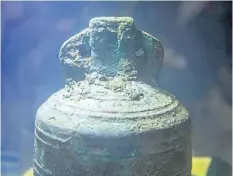  ?? JUSTIN TANG/THE CANADIAN PRESS ?? The ship’s bell from the recently discovered Franklin Expedition shipwreck HMS Erebus sits in pure water in Ottawa in 2014. The bell and other artifacts from the expedition are on display in London, England.