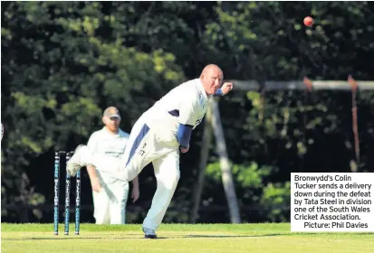  ??  ?? Bronwydd’s Colin Tucker sends a delivery down during the defeat by Tata Steel in division one of the South Wales Cricket Associatio­n.
Picture: Phil Davies