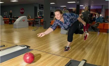  ?? PHOTOS: GLENN JEFFREY/STUFF ?? Malise Thompson bowls during a family trip to Bowlarama in New Plymouth for her daughter Annabelle’s ninth birthday on Saturday.