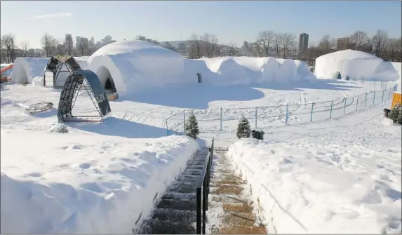  ?? PHOTOS: JOHN KENNEY/ THE GAZETTE ?? This year’s Snow Village, still under constructi­on this month, boasts a restaurant that seats 100, a bar that can hold up to 250 people, an ice chapel and a hotel with 25 rooms. It covers an area of 1.5 acres at Parc Jean-Drapeau. Guy Bélanger, one of...