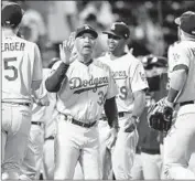  ?? Michael Dwyer Associated Press ?? MANAGER Dave Roberts celebrates after the Dodgers defeated Boston in 12 innings Sunday.