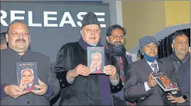  ??  ?? NC president Farooq Abdullah along with party leader Devender Singh Rana (left) during the release of a book in Jammu on Sunday.