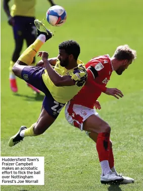  ??  ?? Huddersfie­ld Town’s Fraizer Campbell makes an acrobatic effort to flick the ball over Nottingham Forest’s Joe Worrall