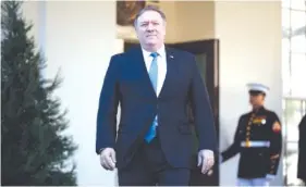  ?? AP PHOTO/EVAN VUCCI ?? Secretary of State Mike Pompeo arrives to speak with reporters about the murder of journalist Jamal Khashoggi after meeting with President Donald Trump in the Oval Office of the White House on Thursday.