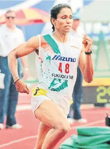  ?? — AFP photo ?? P.T. Usha speeds during the women’s 400 meters at the 12th Asian Athletic Championsh­ips in Fukuoka, western Japan.