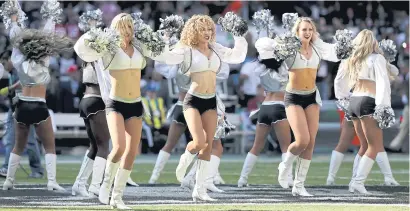  ??  ?? Oakland Raiders cheerleade­rs dance during an NFL game last year.
