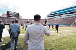  ?? UNM ATHLETICS PHOTO ?? Thomas Viera, a UNM senior who played at La Cueva, takes a photo with his phone upon entering Notre Dame Stadium on Friday.