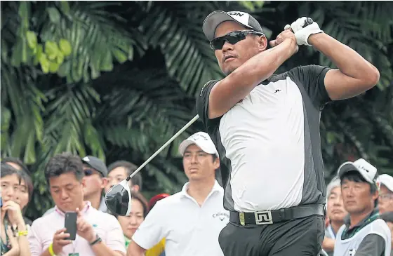  ??  ?? Chapchai Nirat hits a shot in the third round of the Singapore Open at Sentosa Golf Club yesterday.