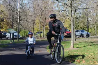  ?? PHOTO BY MICHILEA PATTERSON — FOR MEDIANEWS GROUP ?? A man and a child ride bicycles on the Schuylkill River Trail at Pottstown Riverfront Park.