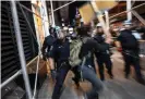  ?? Photograph: John Moore/Getty Images ?? Protesters clash with New York City police in Manhattan on 31 May.