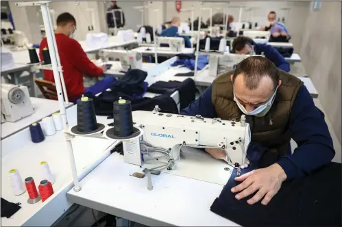  ?? (AP) ?? Inmates produce medical protection equipment Nov. 23 in Zenica.