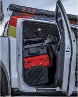  ??  ?? (Left) Pelican storage cases hold gear stacked in the back seat, and the Dometic fridge with
ice maker sits behind the driver seat. (Right) Front and rear fenders, along with the bedsides, were replaced with carbon-fiber widebody components.