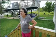  ?? GERALD HERBERT — THE ASSOCIATED PRESS FILE ?? Shirley Verdin stands on May 24on the front steps of her temporary trailer outside her home, which was destroyed by Hurricane Ida on Aug. 29, 2021, along Bayou Point-auChien, in Lafourche Parish, La.